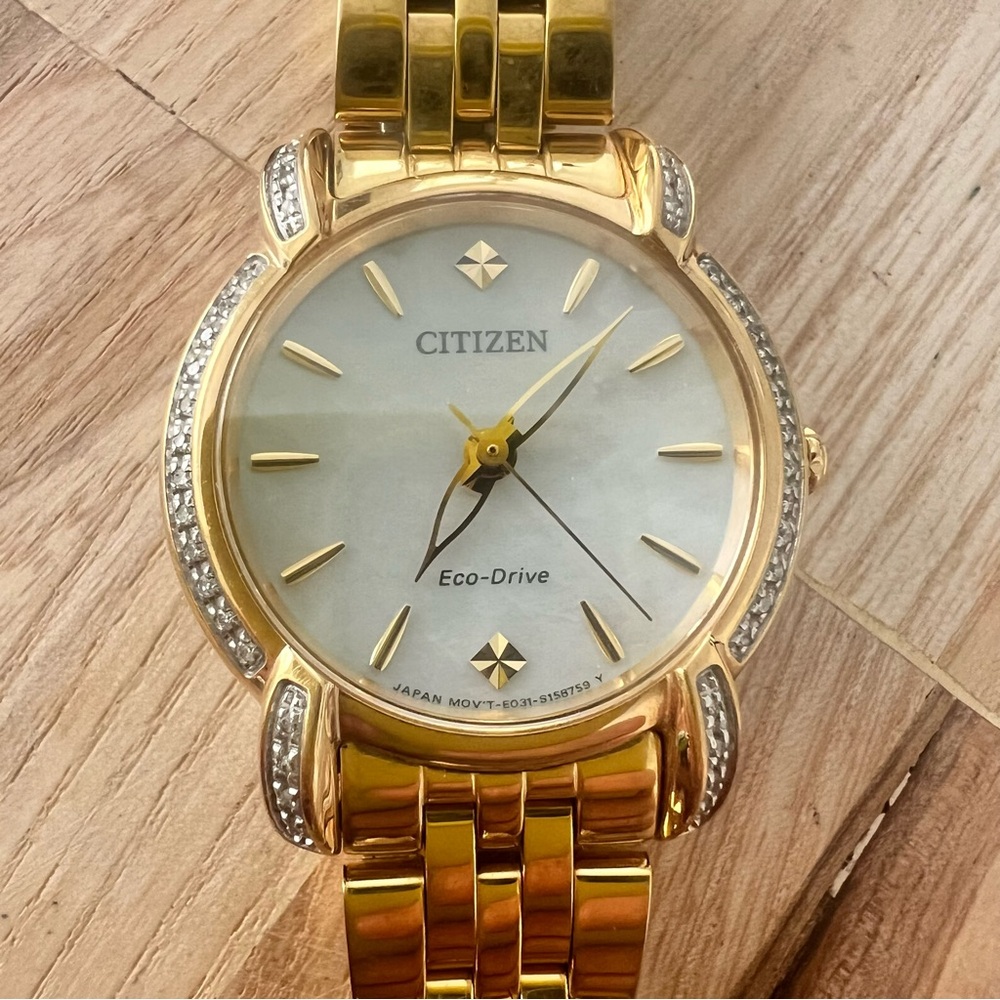 Citizen eco-drive ladies gold tone mother of pearl dial diamond dress watch